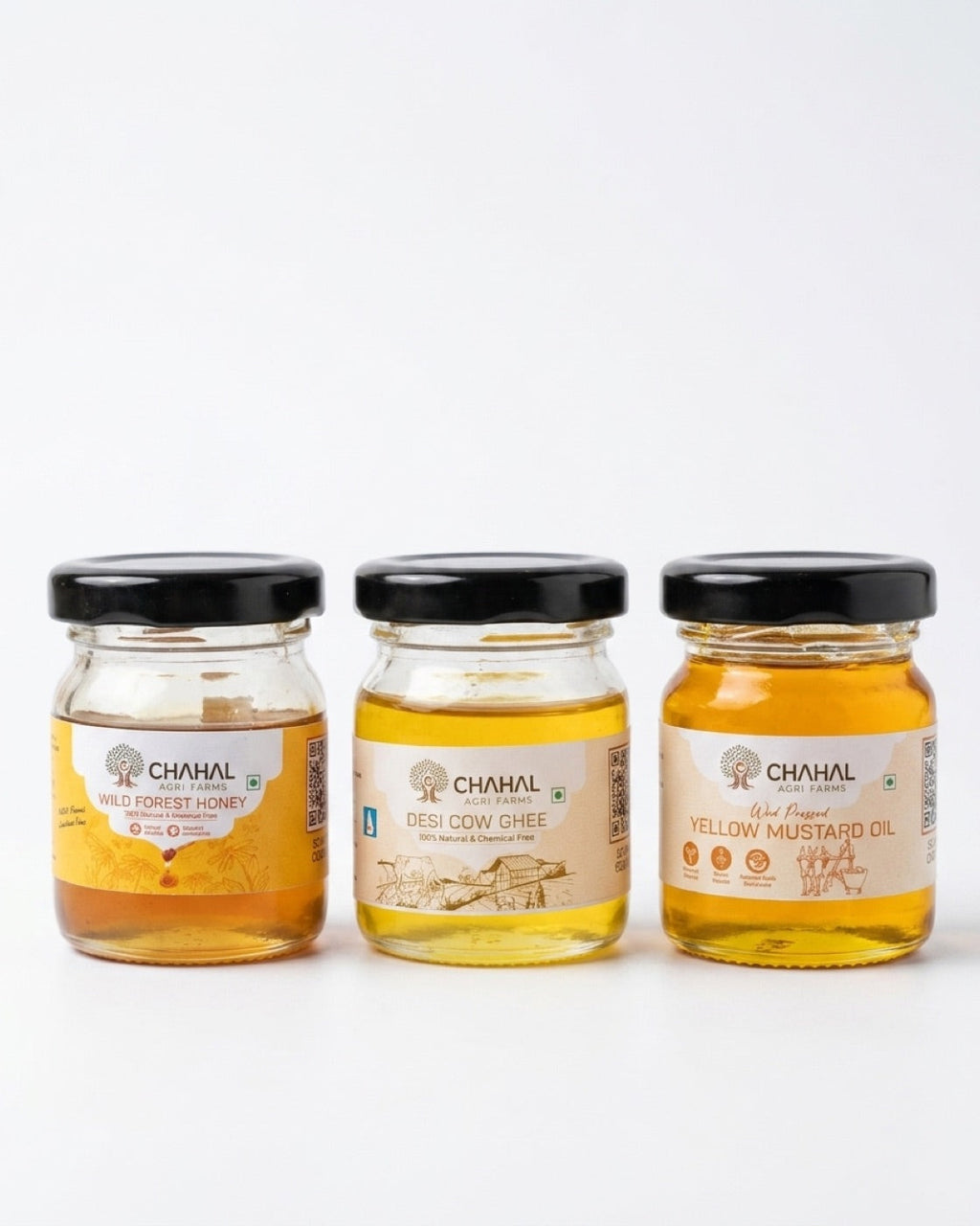 Chahal Agri Farms trial pack — three 50 ml glass jars: wild forest honey, desi cow ghee and wood-pressed yellow mustard oil