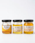Chahal Agri Farms trial pack — three 50 ml glass jars: wild forest honey, desi cow ghee and wood-pressed yellow mustard oil
