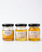 Chahal Agri Farms trial pack — three 50 ml glass jars: wild forest honey, desi cow ghee and wood-pressed yellow mustard oil