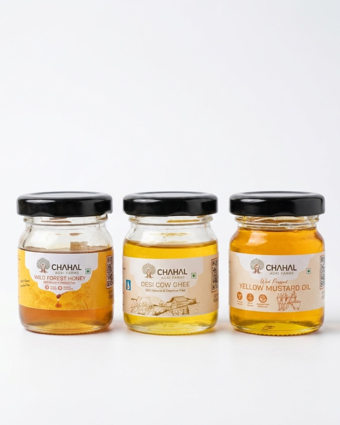 Chahal Agri Farms trial pack — three 50 ml glass jars: wild forest honey, desi cow ghee and wood-pressed yellow mustard oil